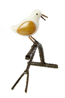 Single Songbird on Branch Stone and Metal Sculpture